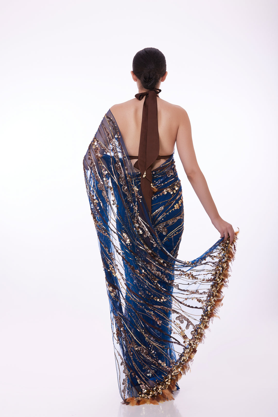 Blue sequins net sari & feather tufts pallu with shaded petticoat