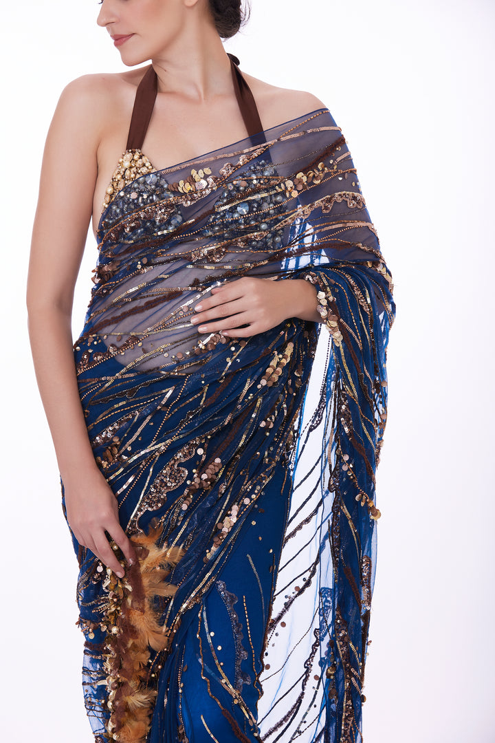 Blue sequins net sari & feather tufts pallu with shaded petticoat