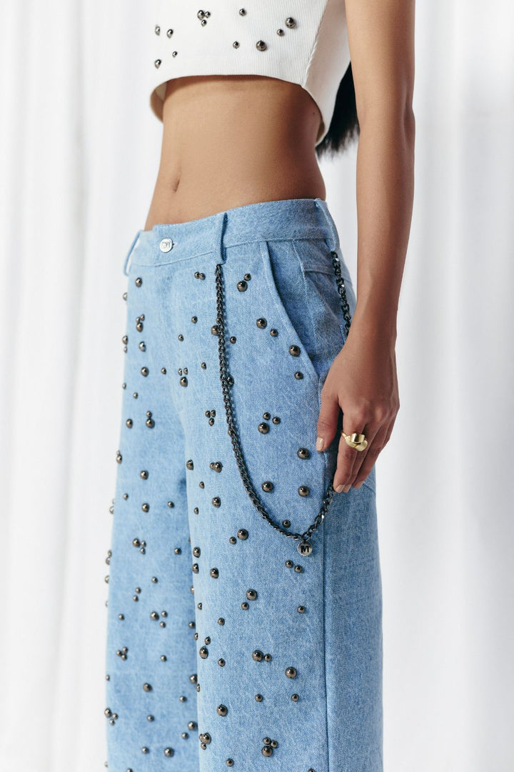 WASHED DENIM STUDDED JEANS