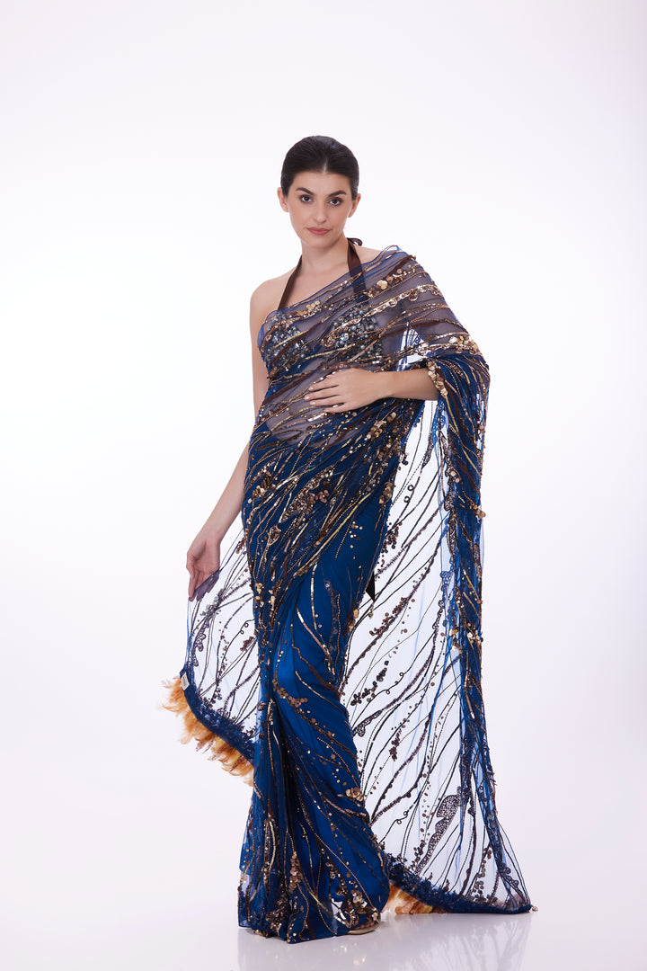 Blue sequins net sari & feather tufts pallu with shaded petticoat