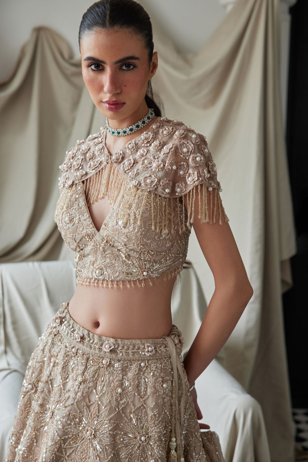 Beige Lehenga with an Embellished Shoulder Cape