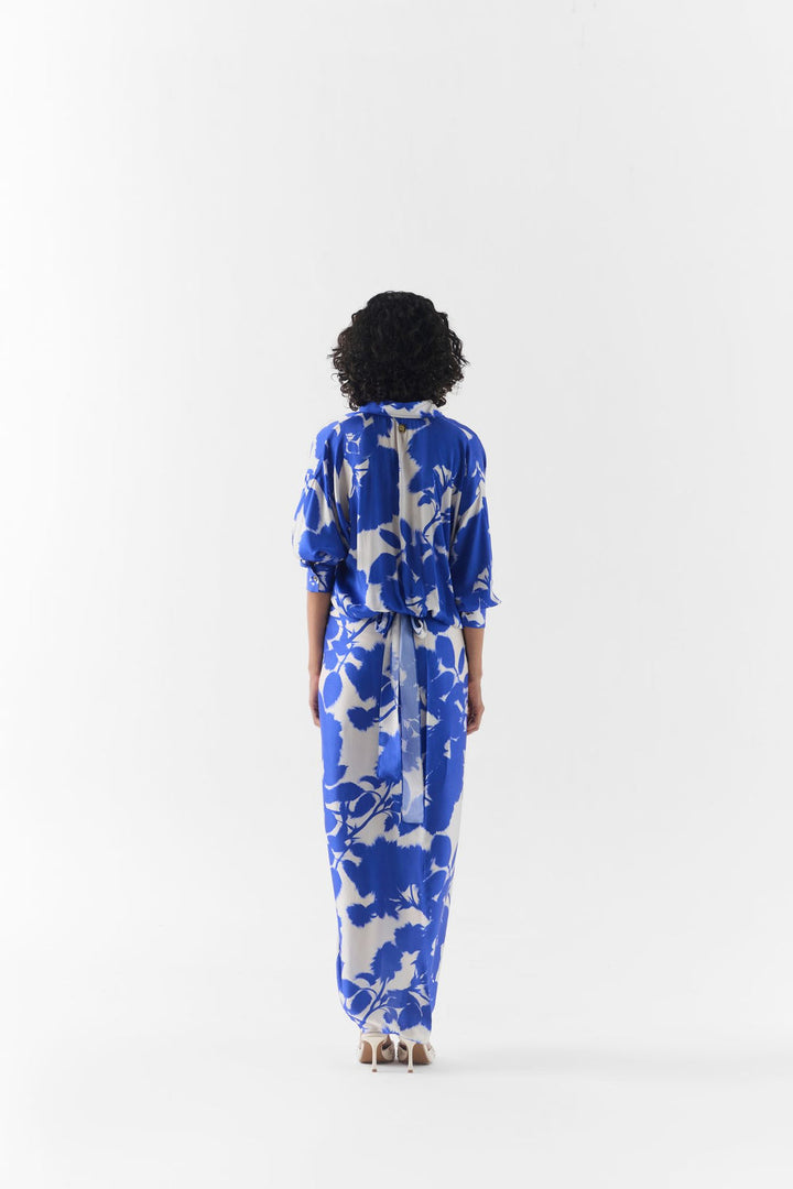 Side view of the Blue Ink Draped Shirt Dress highlighting its fluid drape