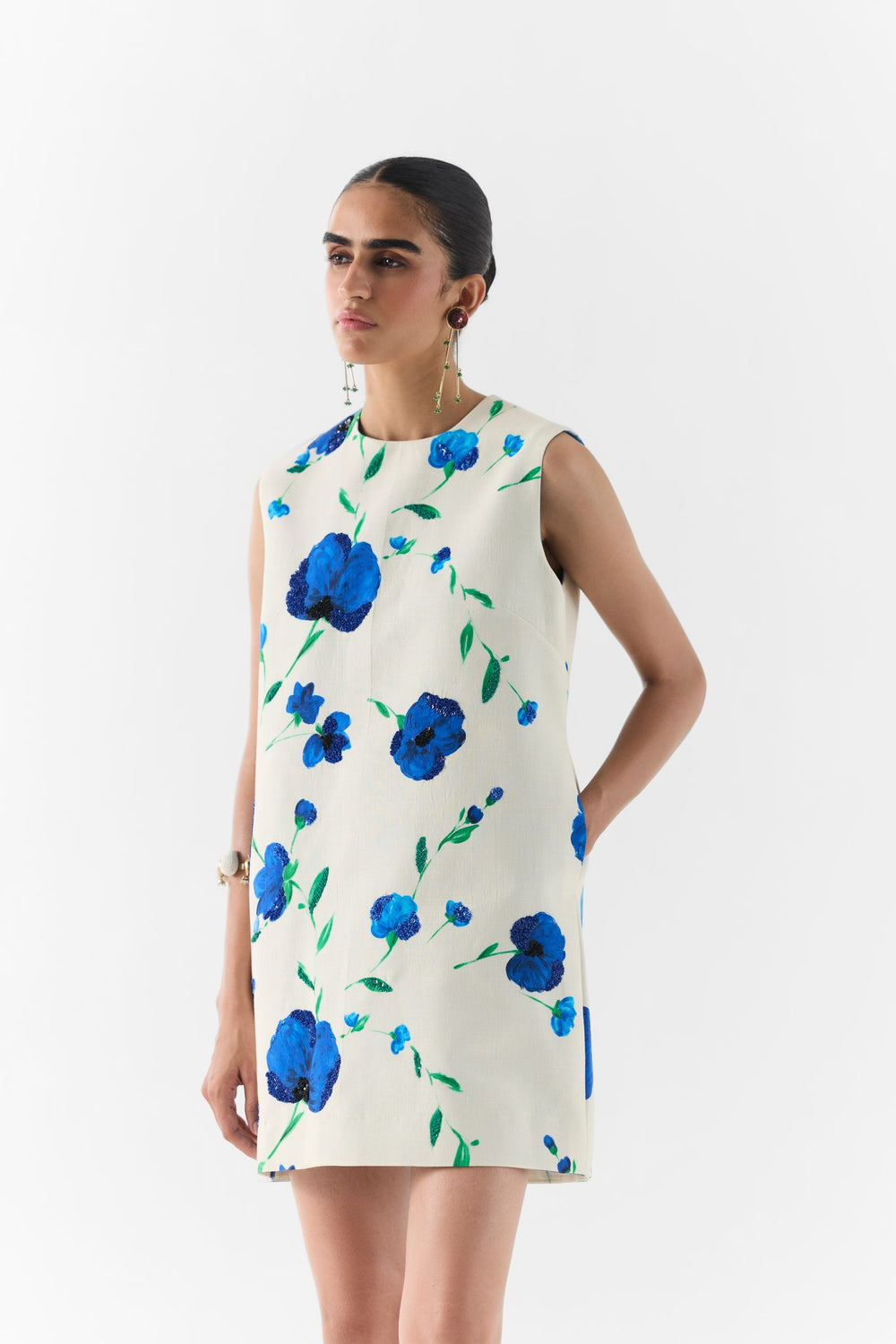 Side view of the Moss Rose short dress showing silhouette and hem