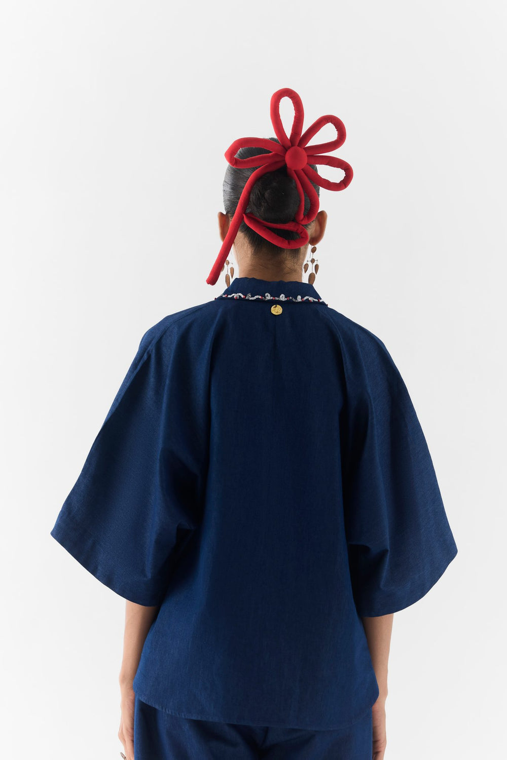 Posy Denim Co-Ord front view on model, floral embroidered denim top and matching trousers